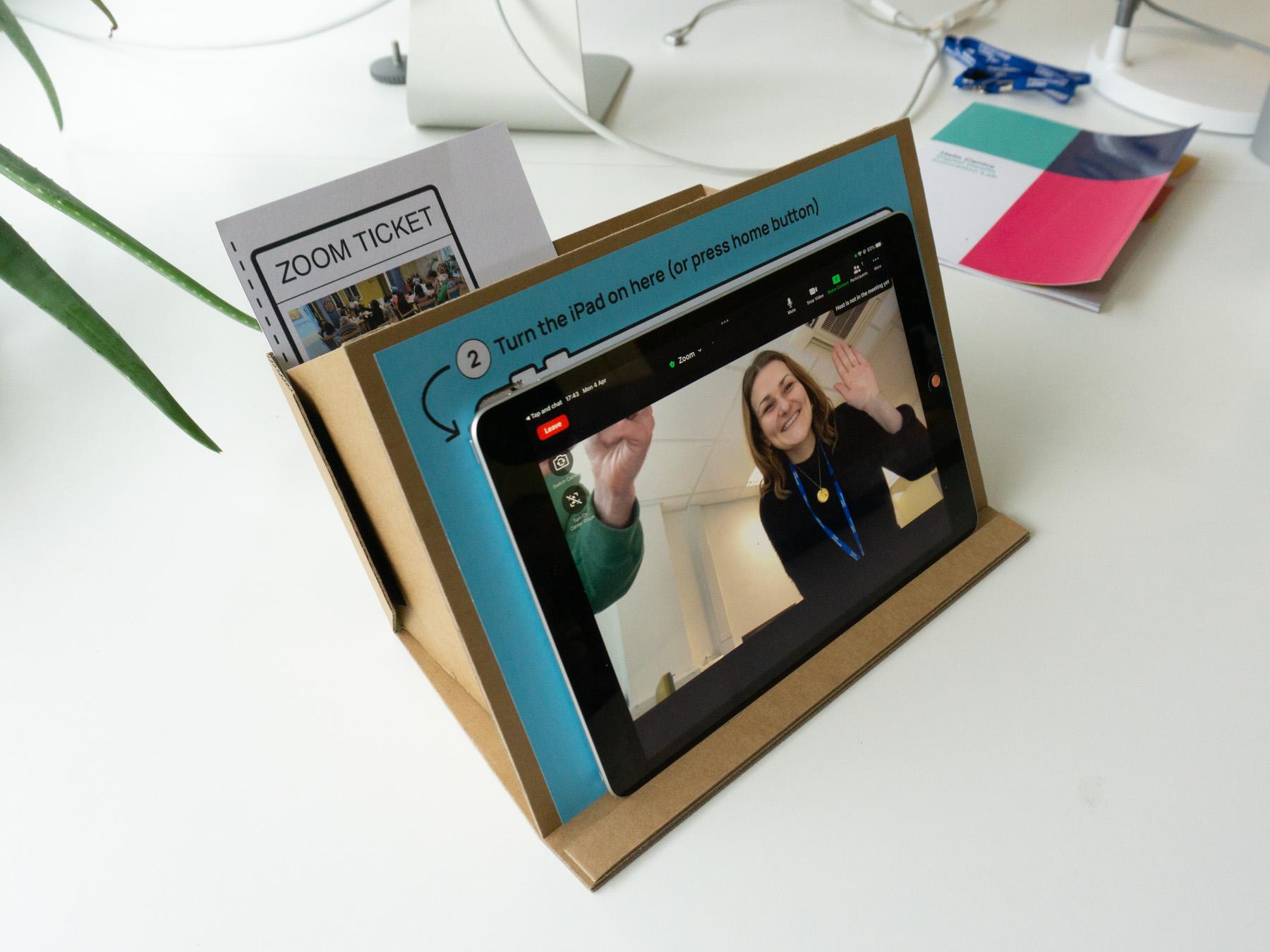 iPad on a cardboard stand